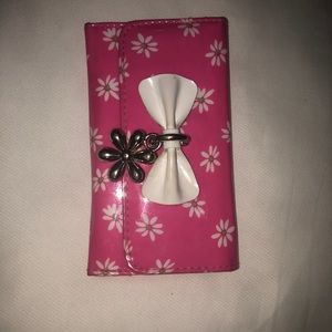 A pink Claire’s wallet